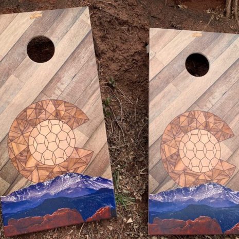 Painted Colorado mountains cornhole game