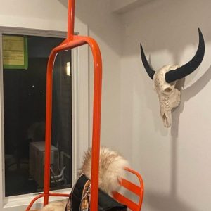Powdered Orange Metal hanging Ski lift Bench