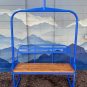 Blue powdered metal ski lift bench