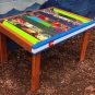 Repurposed ski side table with Colorado flag front board