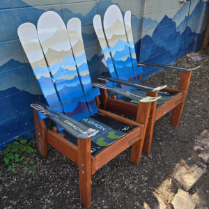 Pair of blue Mystic Mountains Alpine ski chairs built from retired skis on a redwood stained base