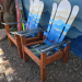 Set of two compact Alpine ski chairs with a blue and white layered mountain mural