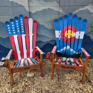 American flag and Colorado flag ski chairs with USA and COLORADO lettered on the front rails