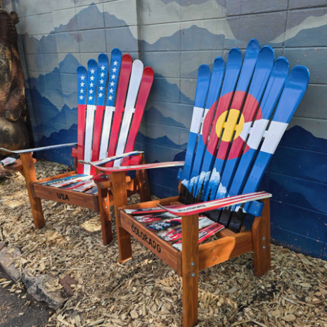 Set of two ski chairs, one painted with the American flag and one with the Colorado flag