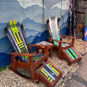 Set of five ski furniture pieces, two Adirondack ski rockers, two ottomans and a side table