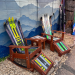 Set of five ski furniture pieces, two Adirondack ski rockers, two ottomans and a side table