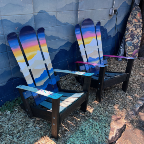 Sunset Alpine Ski Chairs, Angled View Sunset mural Alpine ski chairs on a black stained Douglas Fir base with painted arm accents
