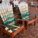 Green mountain mural ski chair set of two outdoors in a Colorado garden setting